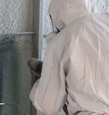 Contractor insulating metal pole barn 